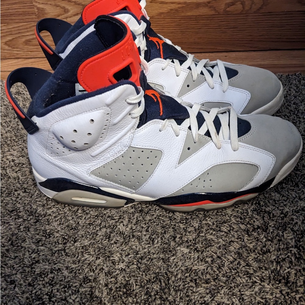 White and Gray High-Top Jordans with Red Accents